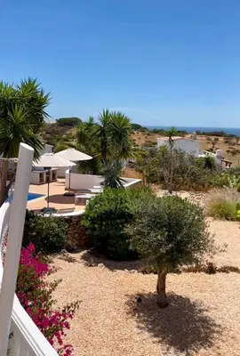 a living room with a couch and a fireplace at Exklusive Luxusvilla - Meerblick - beheizter Pool in Mato Porcas