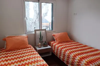 two beds sitting next to each other in a room at Casa Monte Ponta do Sol SeaViews in Ponta do Sol