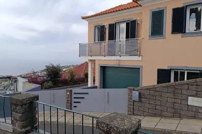 a house with a gate and a fence at Casa Monte Ponta do Sol SeaViews in Ponta do Sol