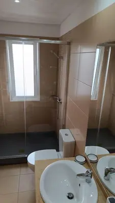 a bathroom with a toilet and a sink and a shower at Casa Monte Ponta do Sol SeaViews in Ponta do Sol