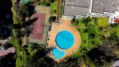 an overhead view of a swimming pool in a park at Caracas Escape by LovelyStay in Funchal