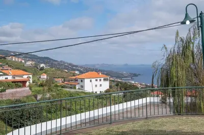 a balcony with a view of the ocean at Vivenda Alves by GALMI in Gaula