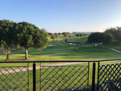a view of a golf course from a fence at Casa com Vista in Lagos