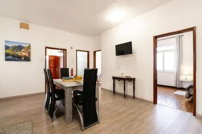 a dining room with a table and chairs at Achada House - Traditional House in Calheta