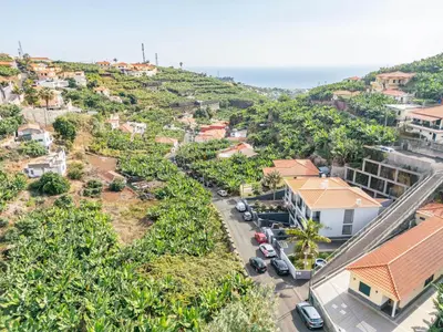 an aerial view of a town with the ocean at Til Home by Homie in Funchal