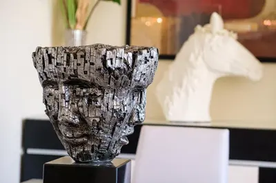 a black and white vase sitting on top of a table at GuestReady - Oasis Getaway in Madeira in Caniço