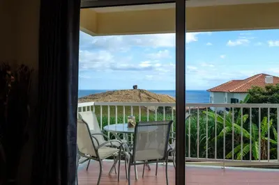 a view of a balcony with a table and chairs at GuestReady - Oasis Getaway in Madeira in Caniço