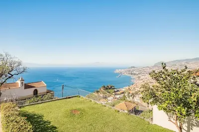 a view of the ocean from a house at THE OLD CHAPEL HOUSE in Funchal