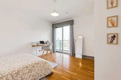 a bedroom with a bed and a desk and a window at THE OLD CHAPEL HOUSE in Funchal