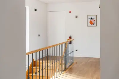 a staircase in a room with white walls at THE OLD CHAPEL HOUSE in Funchal