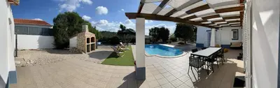 an external view of a house with a swimming pool at Canto do Vale in Aljezur
