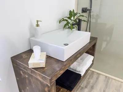 a hallway with a table and a chair in a room at Blue Horizon Luxury Villa in Senhora do Rosário
