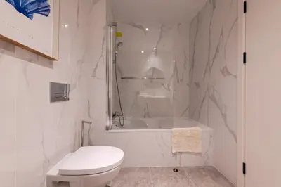 a white bathroom with a shower and a toilet at The Princess Apartment By Sam Houses in Funchal