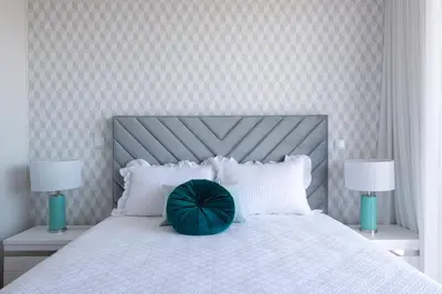 a bedroom with a large white bed with two lamps at The Princess Apartment By Sam Houses in Funchal