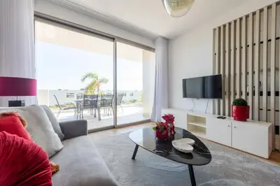 a living room with a couch and a table at The Princess Apartment By Sam Houses in Funchal