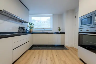 a kitchen with a sink and a stove at The Prince Apartment By Sam Houses in Funchal