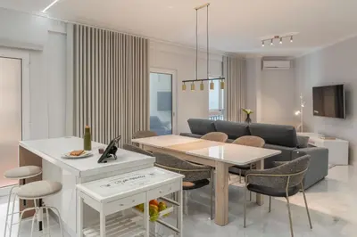 a living room with a table and a couch at Doca do Cavacas I by An Island Apart in Funchal