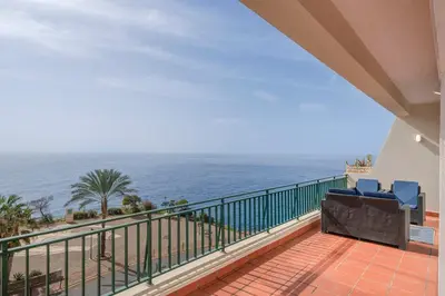 a balcony with a view of the ocean at Doca do Cavacas I by An Island Apart in Funchal