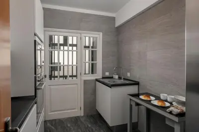 a small kitchen with a sink and a counter at Casa da Cidade by An Island Apart in Funchal