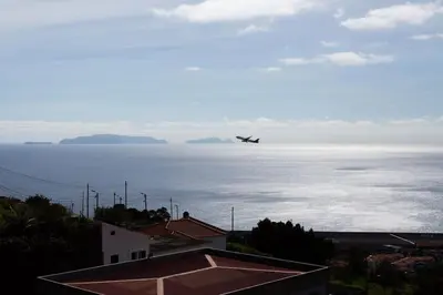 a balcony with a view of the ocean at Dream Paradise in Água de Pena