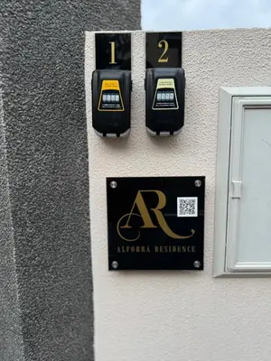 two parking meters on the side of a building at Alforra Residence 1-T2-centro-praias-Levadas in Câmara de Lobos