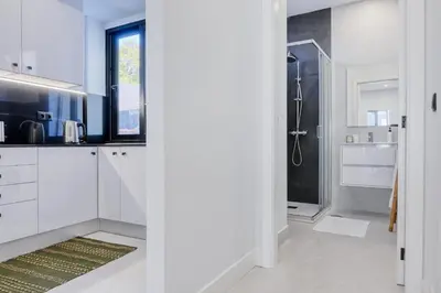 a bathroom with white cabinets and a shower at Beco Santa Emilia 2H, a Home in Madeira in Funchal