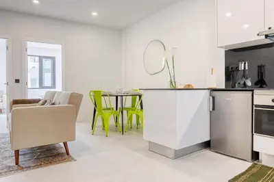 a kitchen and dining room with a table and chairs at Beco Santa Emilia 2H, a Home in Madeira in Funchal