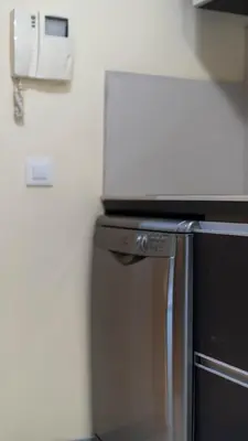 a kitchen with a microwave on top of a refrigerator at Sunscape T2 in Funchal