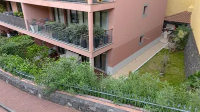 an apartment building with plants on the balconies at Sunscape T2 in Funchal