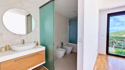 a bathroom with a sink and a mirror at Allure Alannas Villa by LovelyStay in Funchal