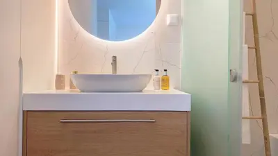 a bathroom with a sink and a mirror at Allure Alannas Villa by LovelyStay in Funchal