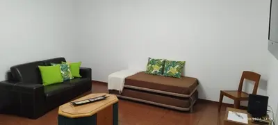 a living room with a couch and a chair at Porto Santo Island Ocean Apartment in Vila Baleira