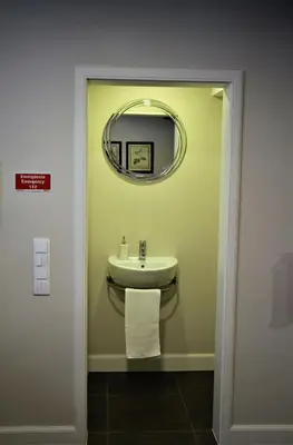 a bathroom with a sink and a mirror at Guest house Santa Maria in Funchal
