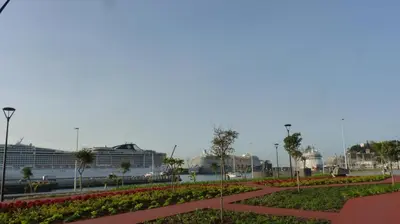 a park with flowers and cruise ships in the background at Guest house Santa Maria in Funchal