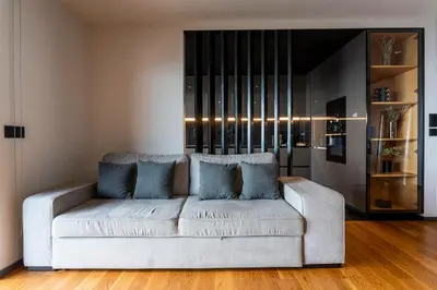 a living room with a white couch with blue pillows at Madeira Four Seasons in Funchal