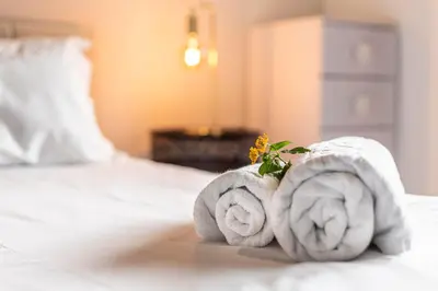 two towels sitting on top of a bed at Madeira Four Seasons in Funchal