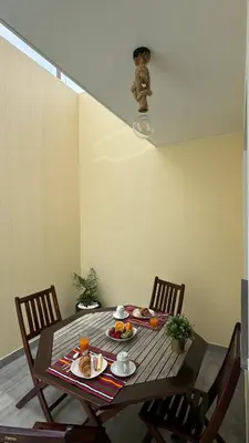 a wooden table with food on it in a room at VCS House by Madeira Holiday in Funchal