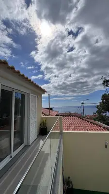 a balcony of a house with a roof at VCS House by Madeira Holiday in Funchal