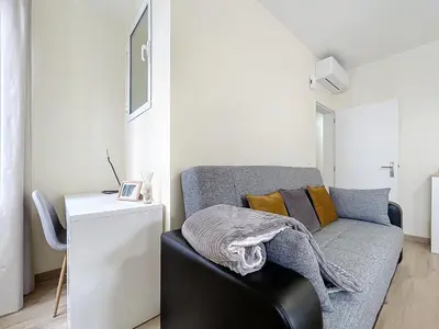 a living room with a gray couch and a table at Marias Place by Atlantic Holiday in Funchal