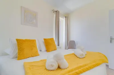 a bedroom with two stuffed animals on a bed at Marias Place by Atlantic Holiday in Funchal