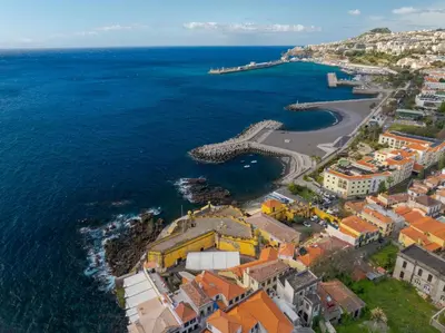 an aerial view of a town next to the ocean at Marias Place by Atlantic Holiday in Funchal
