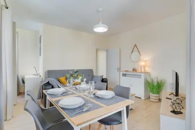a dining table and chairs in a living room at Marias Place by Atlantic Holiday in Funchal