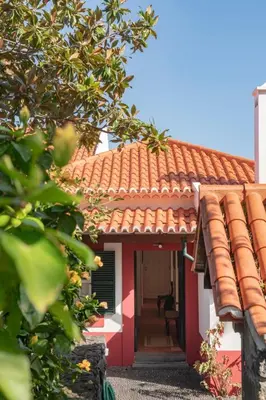 a red and white house with a red roof at Casa do Terreiro by An Island Apart in São Vicente