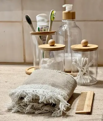 a towel and toothbrushes are sitting on the floor at Profetas GuestHouse in Porto Santo