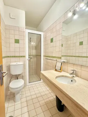 a bathroom with a toilet and a sink and a shower at Profetas GuestHouse in Porto Santo