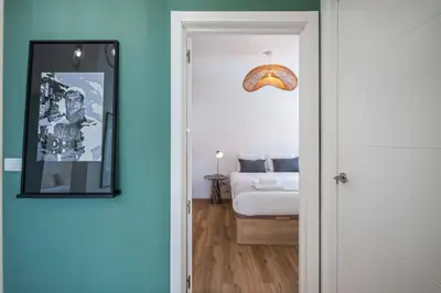 a door leading to a bedroom with a bed at Cozy Retreat - By WeHost in Funchal