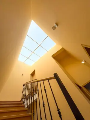 a skylight in a building with stairs and a window at GuestReady - One happy stay in Machico in Santa Cruz