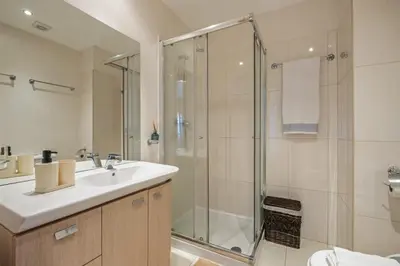 a bathroom with a sink and a shower at Canico City Center by Zest and Guest in Santa Cruz