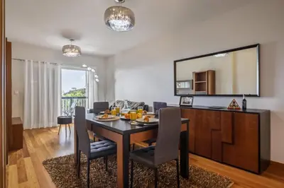 a dining room with a table and chairs at Canico City Center by Zest and Guest in Santa Cruz