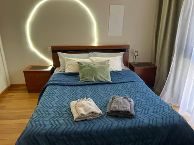 a bedroom with a bed with two towels on it at Apartment Machico near the beach in Machico